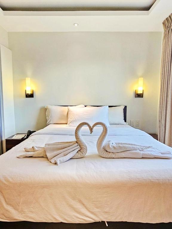 Postel nebo postele na pokoji v ubytování Valentino's Hotel