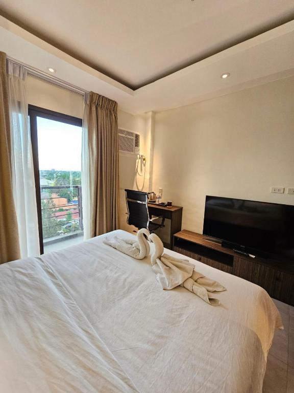 Postel nebo postele na pokoji v ubytování Valentino's Hotel