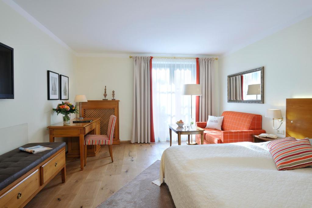 Postel nebo postele na pokoji v ubytování Hotel Gut Ising