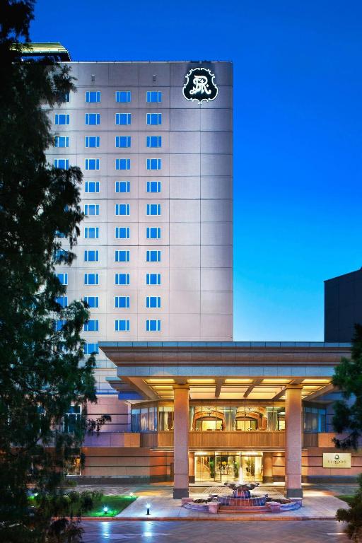 a hotel building with a logo on the side of it at The St. Regis Beijing in Beijing