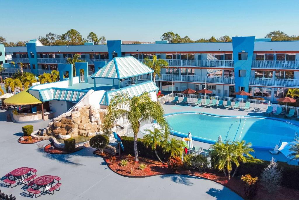an aerial view of a resort with a swimming pool at Ramada by Wyndham Flamingo Water Park in Kissimmee