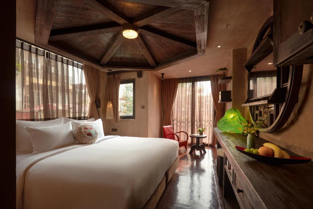 Postel nebo postele na pokoji v ubytování Kecho Legacy Hotel Hanoi & Spa