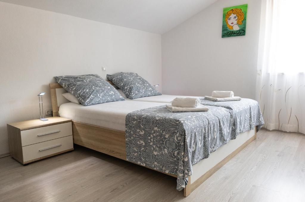 Ένα ή περισσότερα κρεβάτια σε δωμάτιο στο Apartments Anita