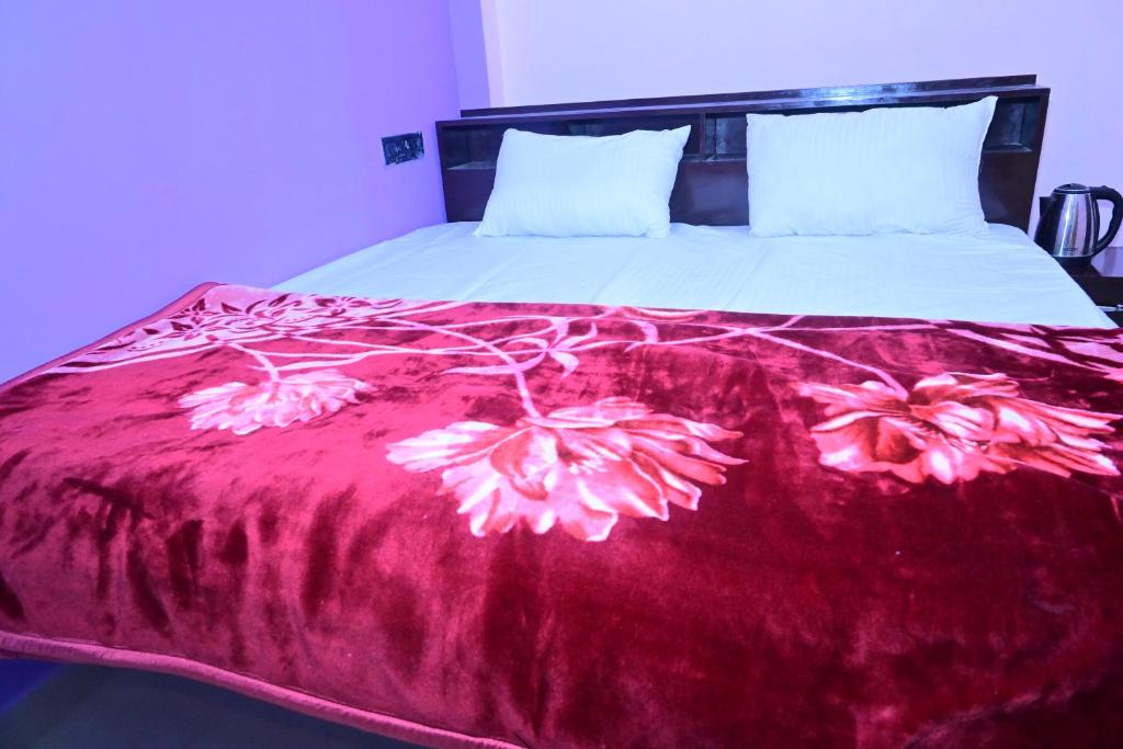 Postel nebo postele na pokoji v ubytování Pragya Villa Stay
