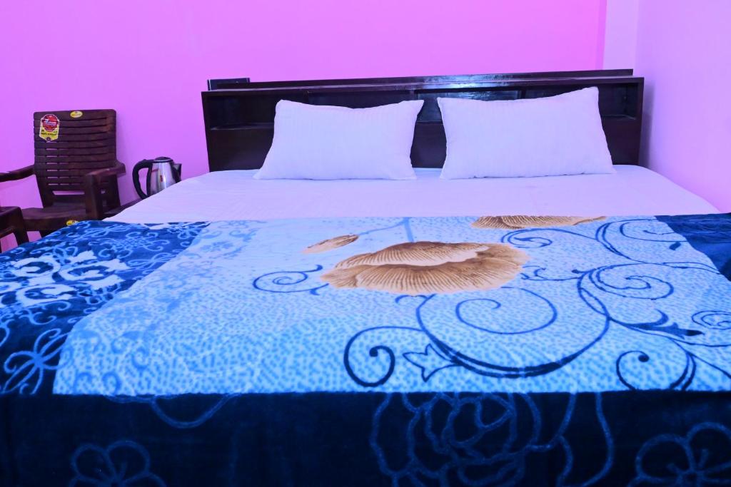Postel nebo postele na pokoji v ubytování Pragya Villa Stay