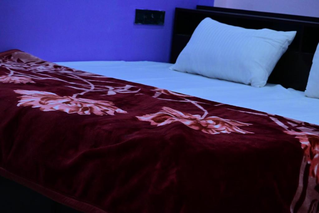 Postel nebo postele na pokoji v ubytování Pragya Villa Stay