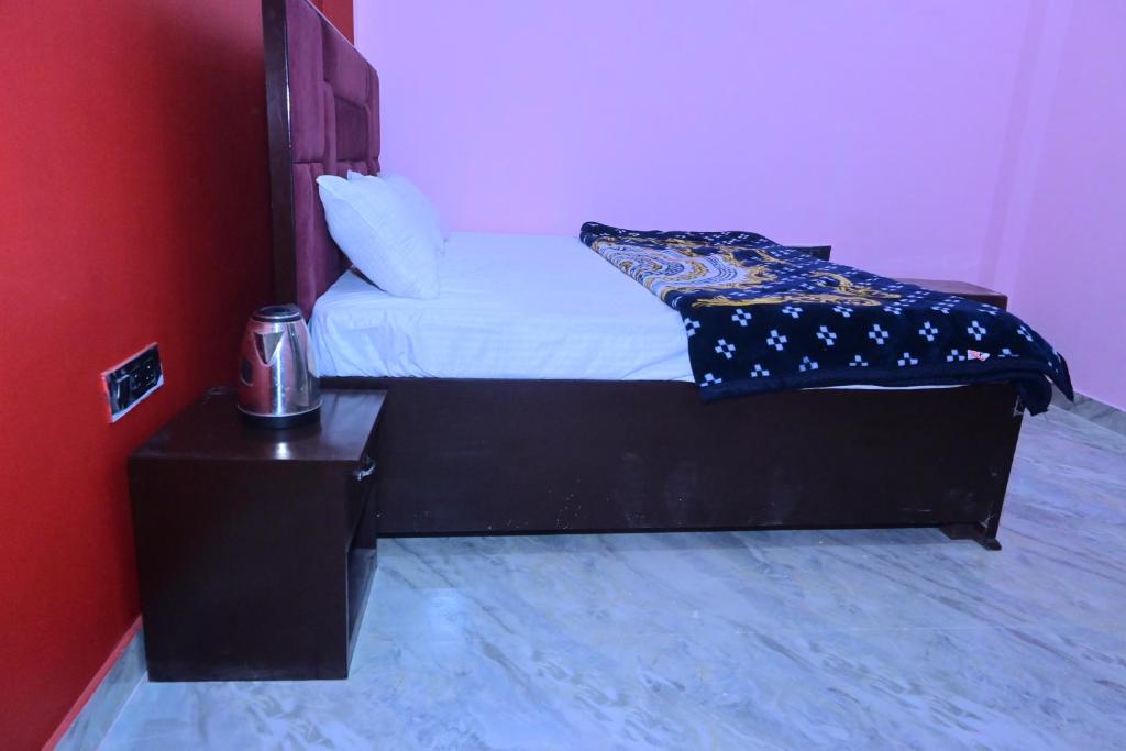 Postel nebo postele na pokoji v ubytování Pragya Villa Stay
