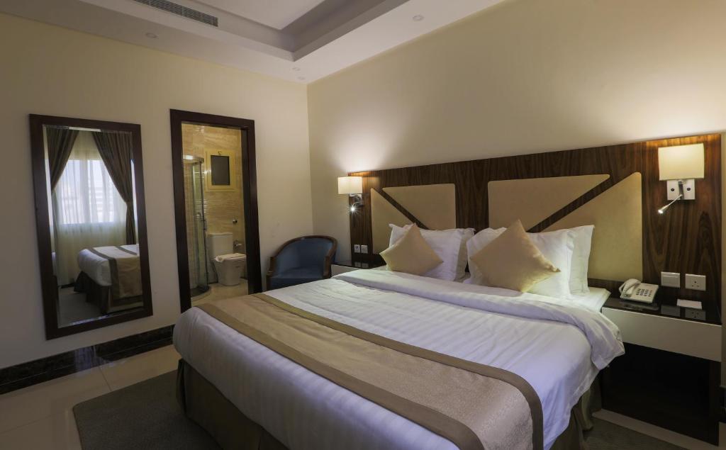 Postel nebo postele na pokoji v ubytování Sun Park Hotel Suites