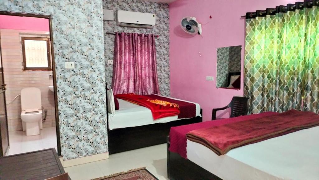 Voodi või voodid majutusasutuse Premshi Guest House toas