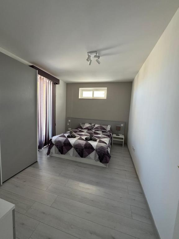 Letto o letti in una camera di Skyline Soak, Views & Jacuzzi