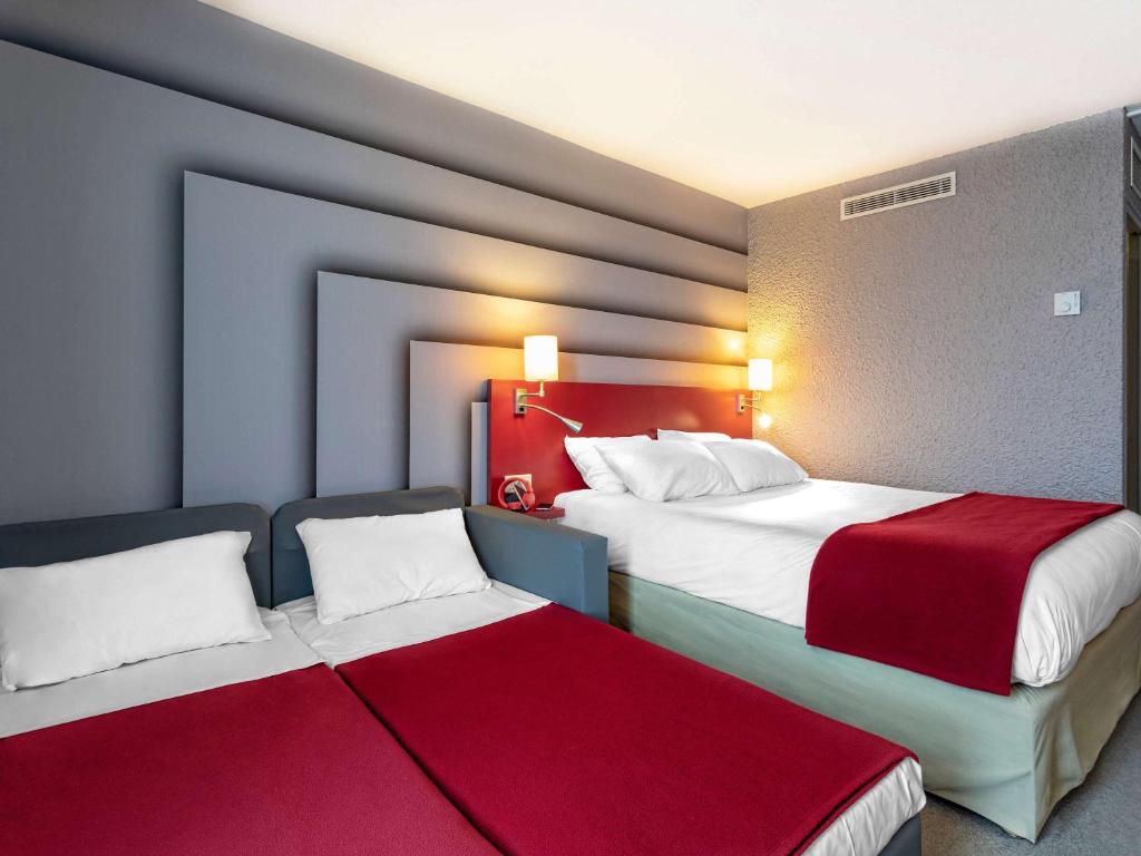 Postel nebo postele na pokoji v ubytování ibis Styles Avignon Sud