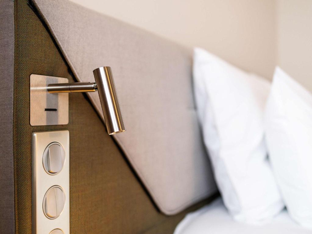 Postel nebo postele na pokoji v ubytování Novotel Brugge Centrum