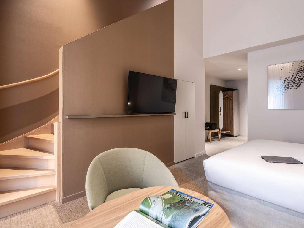 Postel nebo postele na pokoji v ubytování Novotel Brugge Centrum