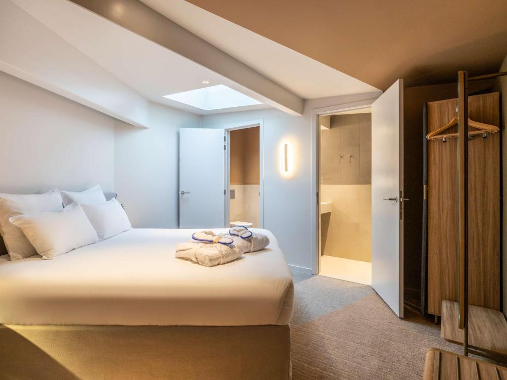 Postel nebo postele na pokoji v ubytování Novotel Brugge Centrum