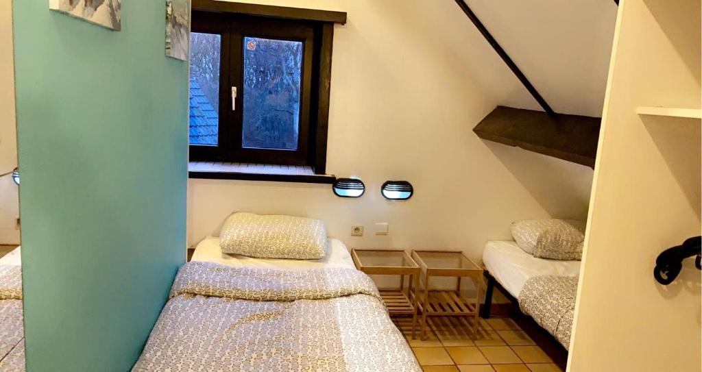 Postel nebo postele na pokoji v ubytování Gîte du sanglier