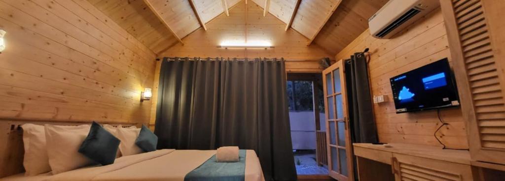 TV a/nebo společenská místnost v ubytování Sand Tent Beach Resort Patnem