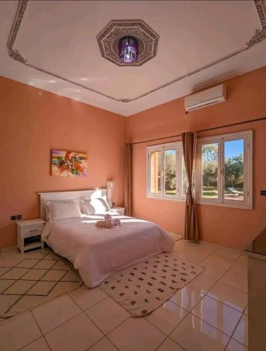 Postel nebo postele na pokoji v ubytování Maison Jannate Louise