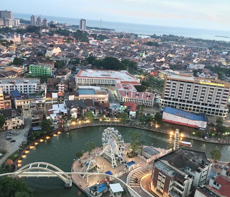 an aerial view of a city with a ferris wheel at LUXURY 3r2b Penthouse The Shore Hotel & Residences in Melaka