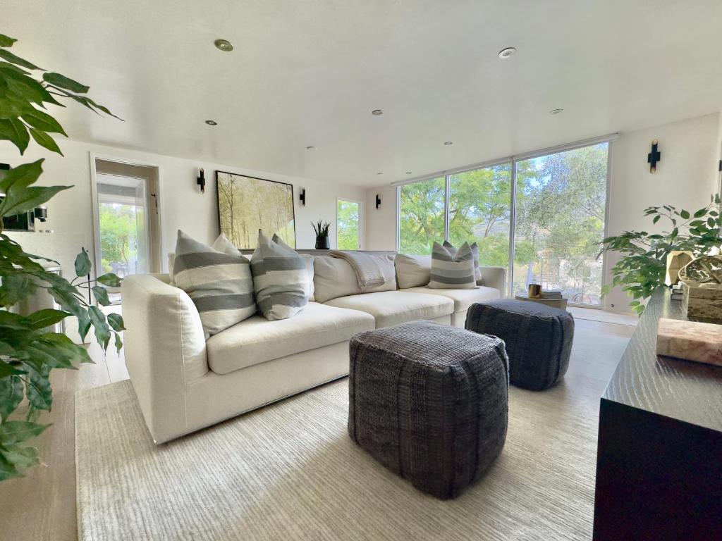 a large living room with a couch and a table at The Glass House Montecito in Santa Barbara