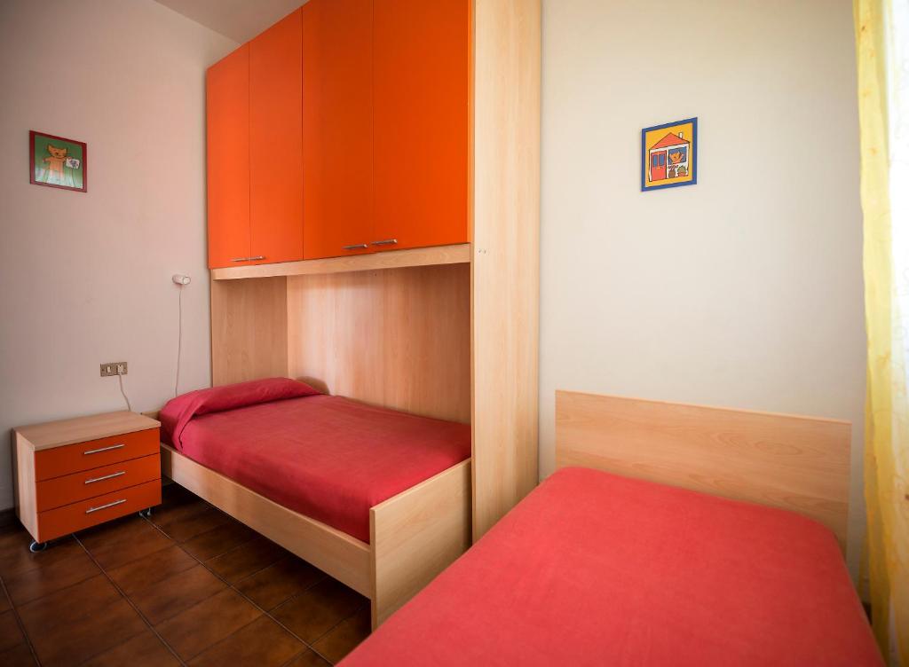 Posteľ alebo postele v izbe v ubytovaní Caletta Apartments