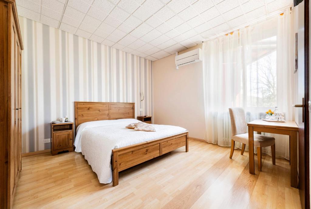 Postel nebo postele na pokoji v ubytování Le Betulle, Villa Ferrari