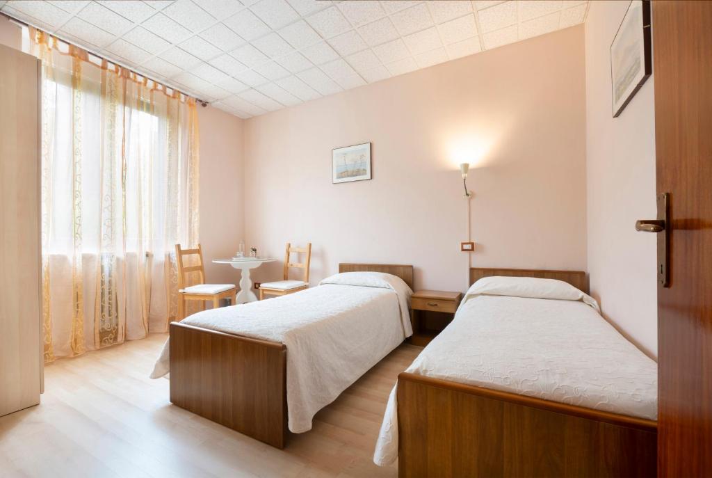 Postel nebo postele na pokoji v ubytování Le Betulle, Villa Ferrari