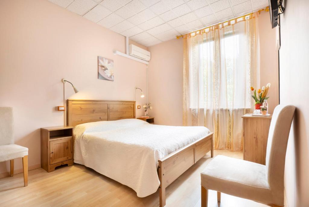 Postel nebo postele na pokoji v ubytování Le Betulle, Villa Ferrari