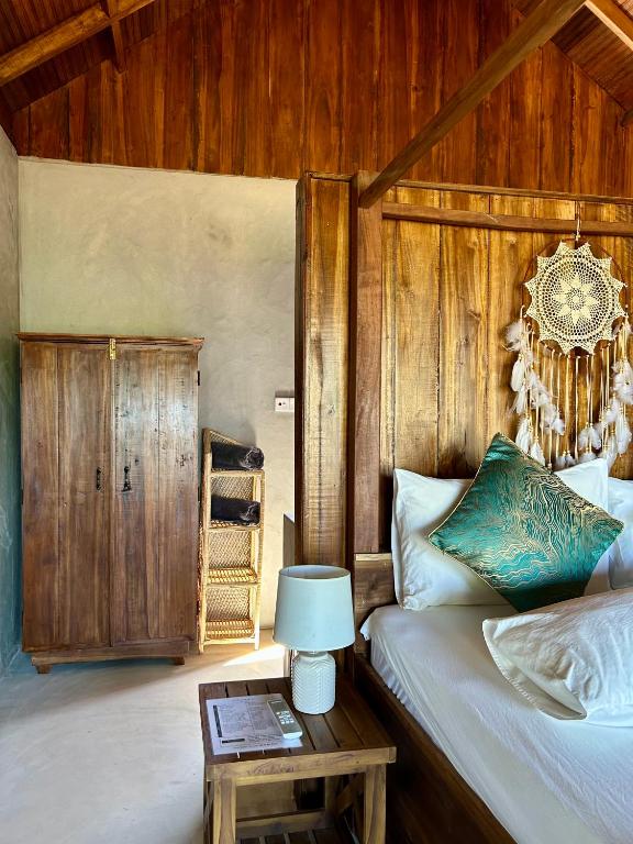 Postel nebo postele na pokoji v ubytování Arasi Resort