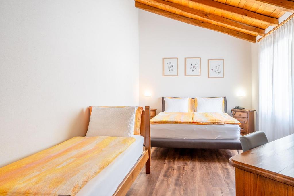 Postel nebo postele na pokoji v ubytování Hotel Il Castagno