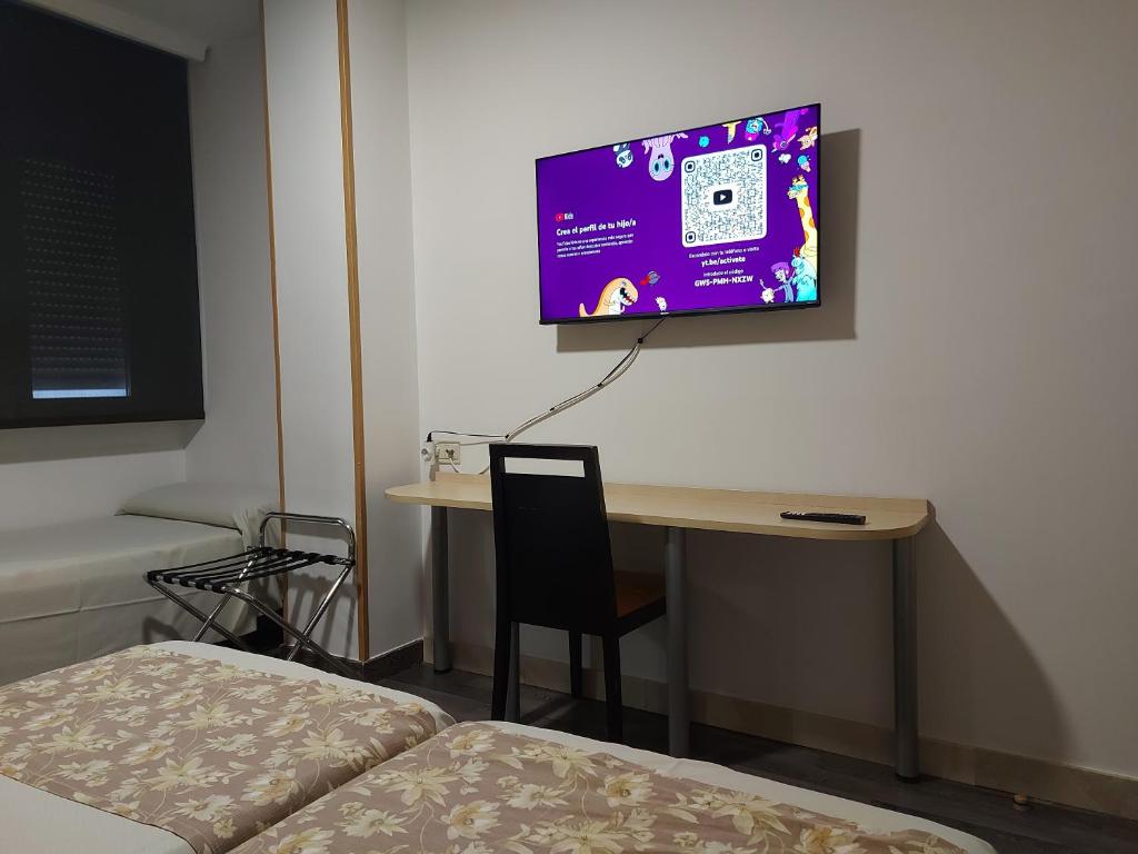 Postel nebo postele na pokoji v ubytování Hotel Universal