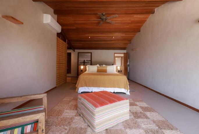 Cama ou camas em um quarto em Barracuda Boutique
