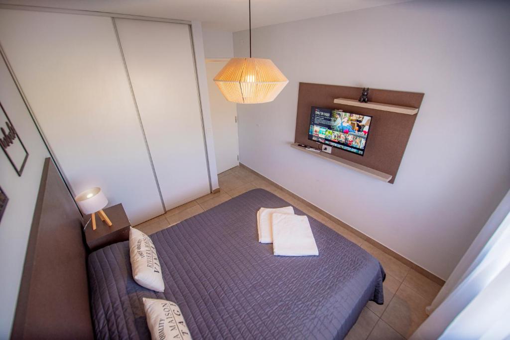 TV a/nebo společenská místnost v ubytování Río Cuarto Host