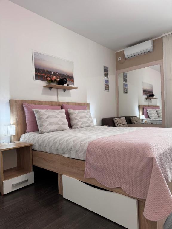 Postel nebo postele na pokoji v ubytování Post apartmani A-1