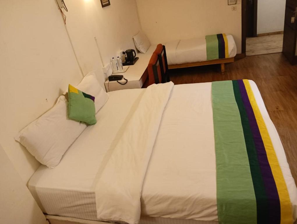 Postel nebo postele na pokoji v ubytování Hotel Crown