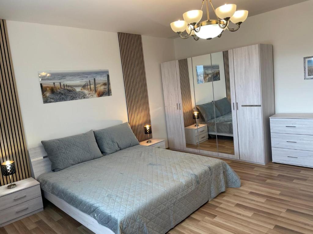 Ένα ή περισσότερα κρεβάτια σε δωμάτιο στο Aparthotel Praha