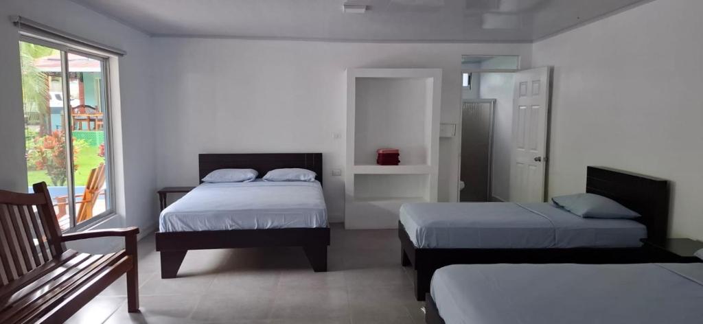 Postel nebo postele na pokoji v ubytování Hotel Marielos