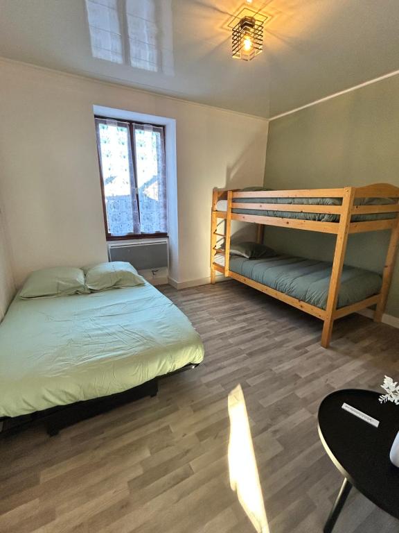 Postel nebo postele na pokoji v ubytování L'Échappée Creusoise