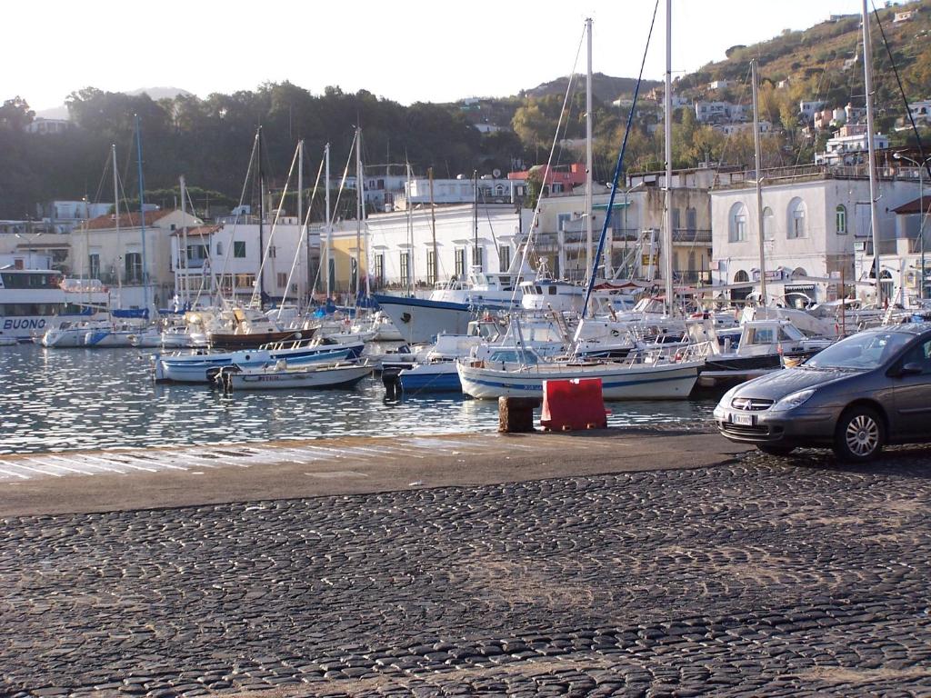 a group of boats docked in a harbor at Albergo Locanda Sul Mare in Ischia