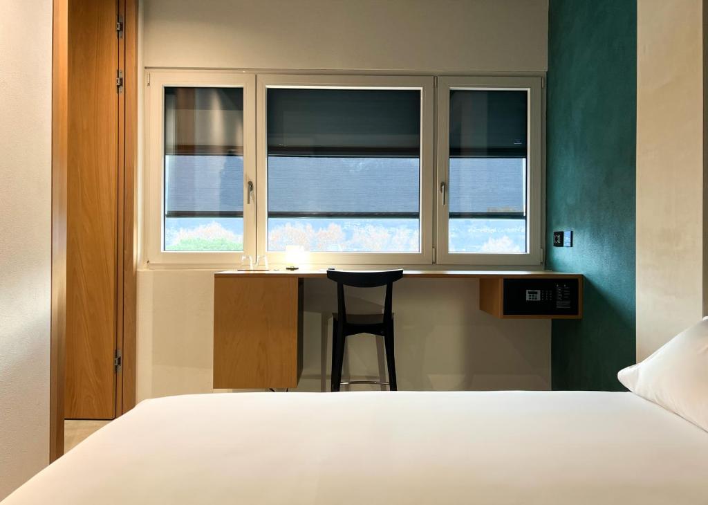 Postel nebo postele na pokoji v ubytování Riva Rooms & Studios - Check-In 24hr
