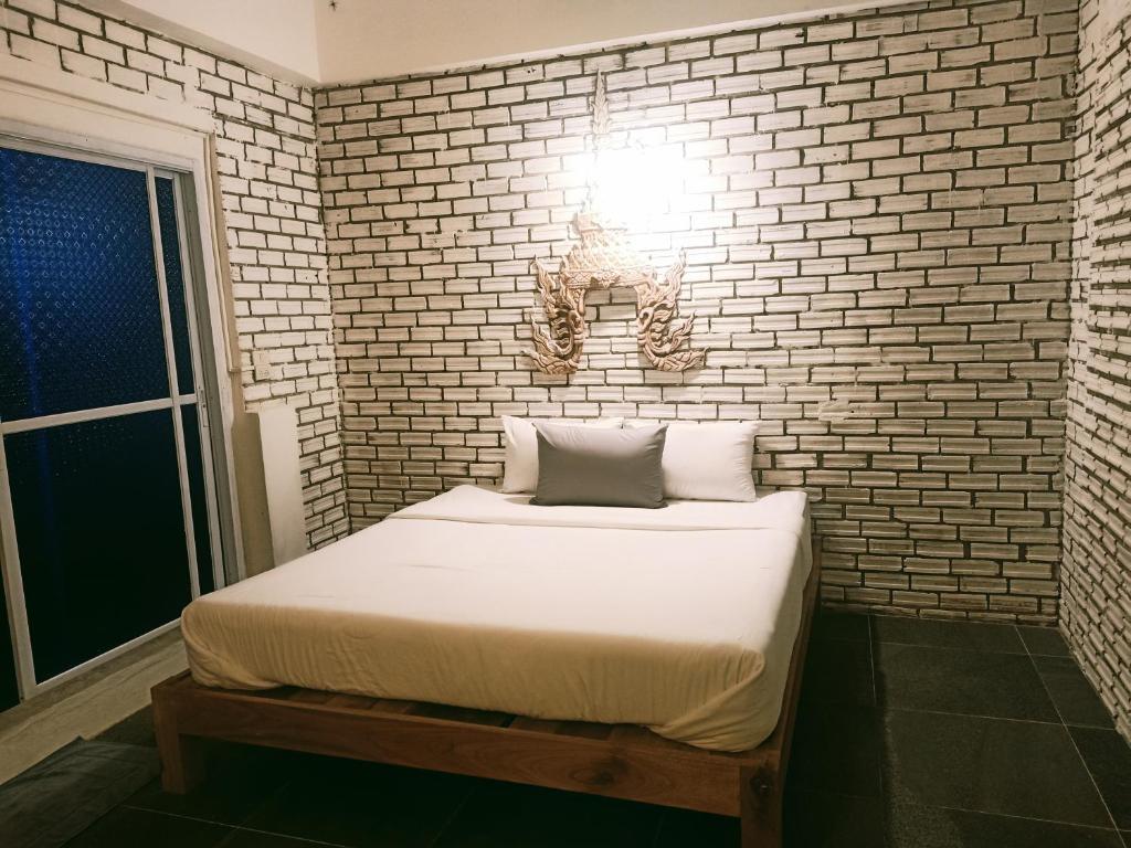 Postel nebo postele na pokoji v ubytování Anodash Homestay