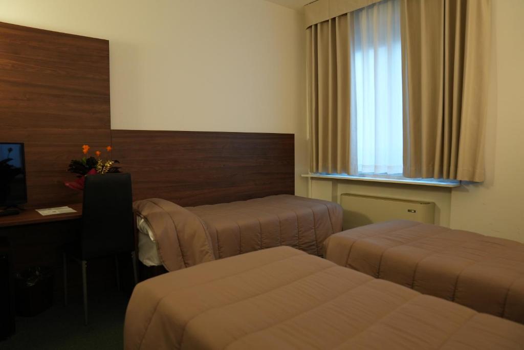 Postel nebo postele na pokoji v ubytování Hotel Albatros