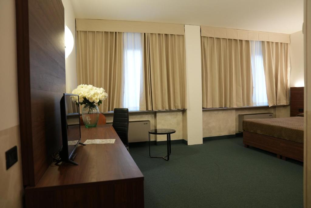 Postel nebo postele na pokoji v ubytování Hotel Albatros
