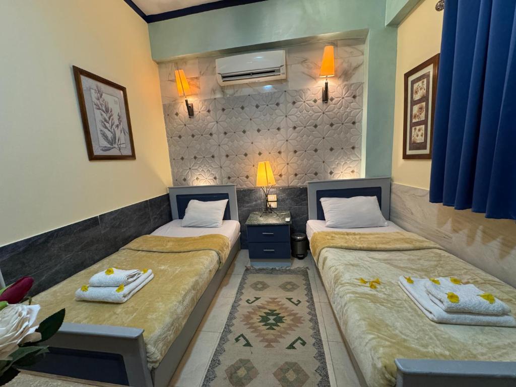 Postel nebo postele na pokoji v ubytování Sababa Hotel