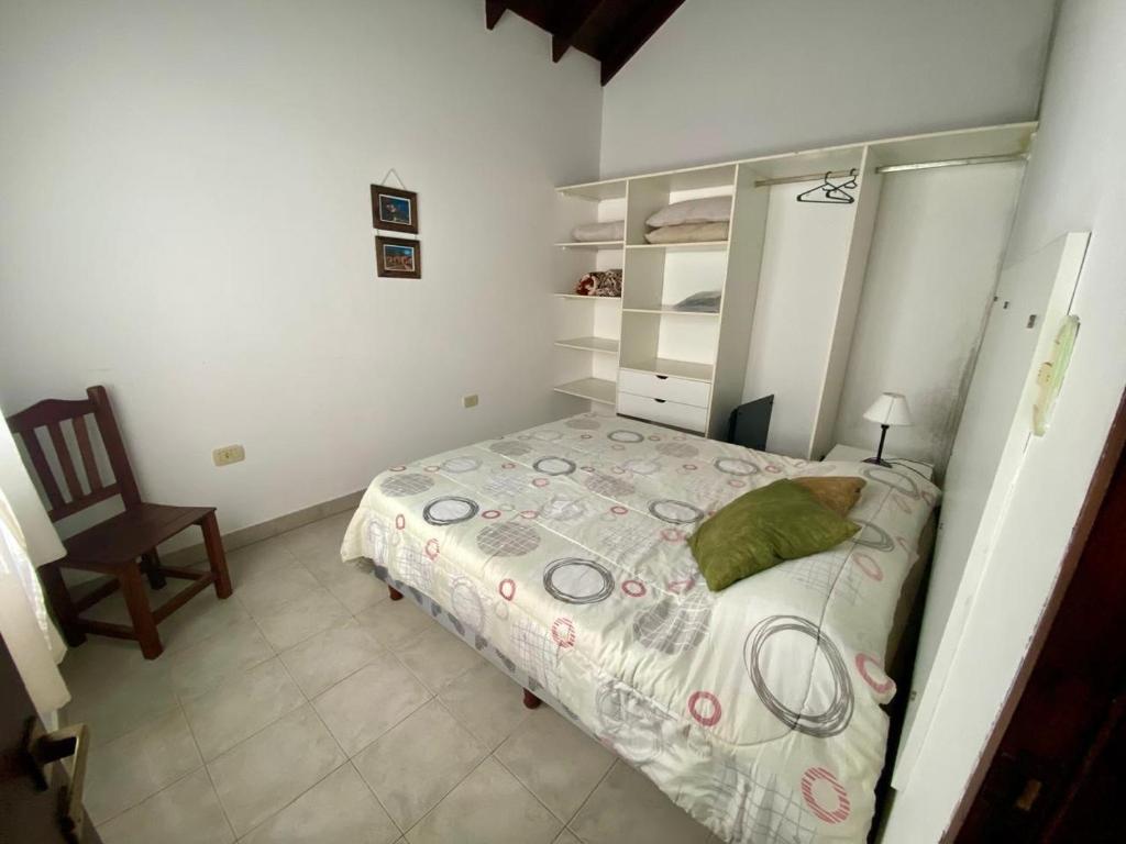 Postel nebo postele na pokoji v ubytování Pirpintos, Cabanas de San Lorenzo