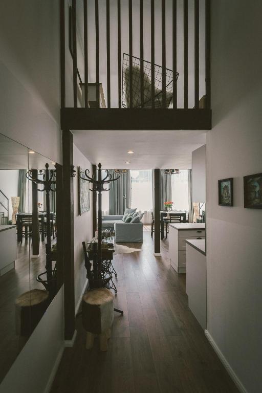 a living room with a loft bed and a kitchen at "Hunter's Suite"- at the heart of Hartberg I Parking in Hartberg