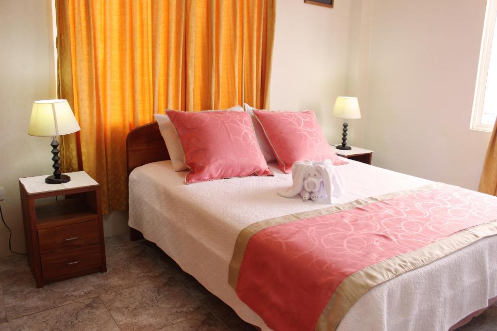 Postel nebo postele na pokoji v ubytování Hotel Del Sol Galapagos