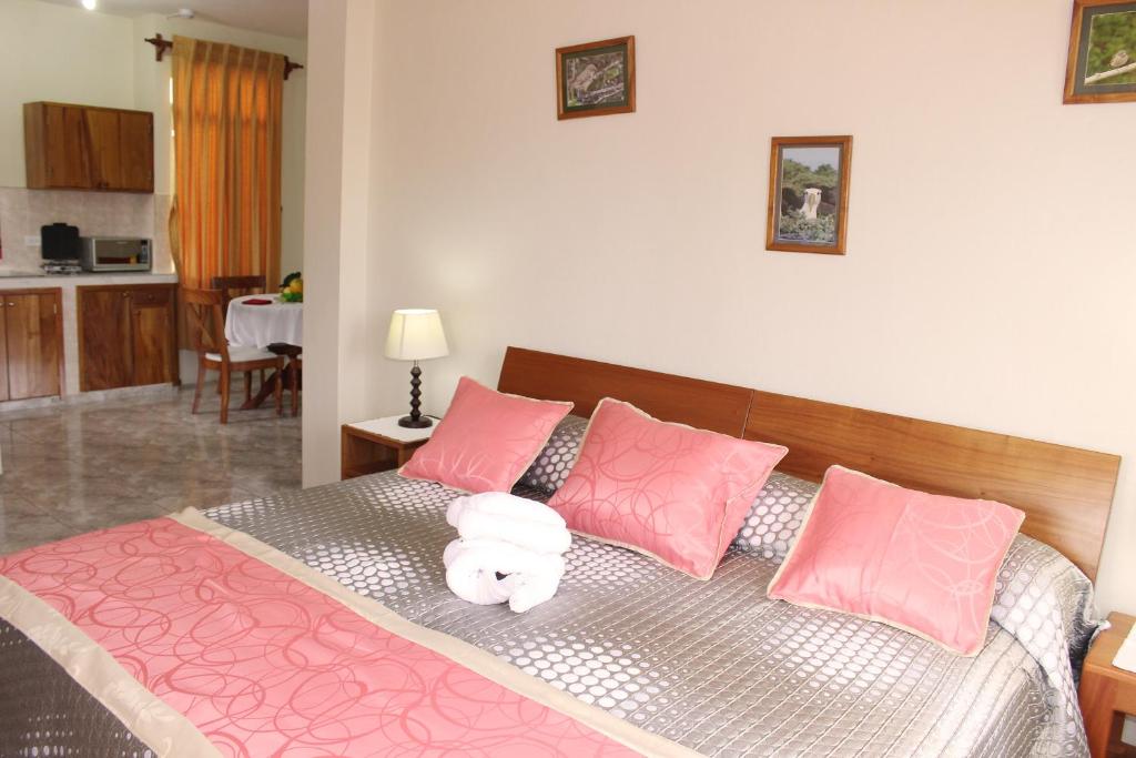 Postel nebo postele na pokoji v ubytování Hotel Del Sol Galapagos