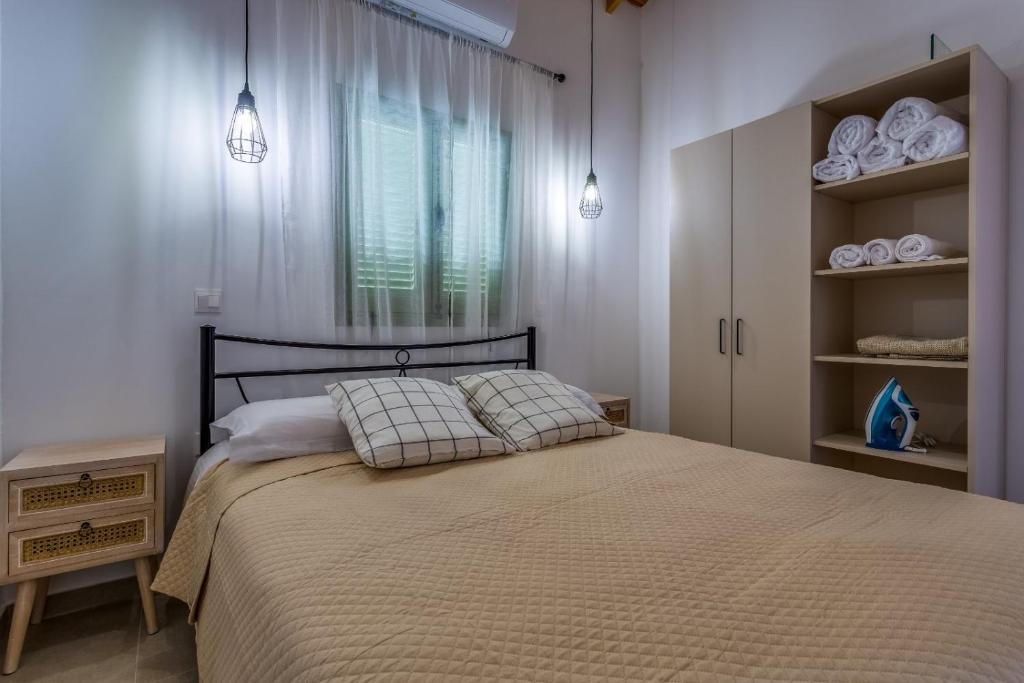 Postel nebo postele na pokoji v ubytování Eleonas Seaview Cottages