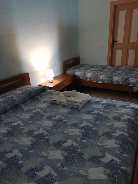 Łóżko lub łóżka w pokoju w obiekcie domus Verde