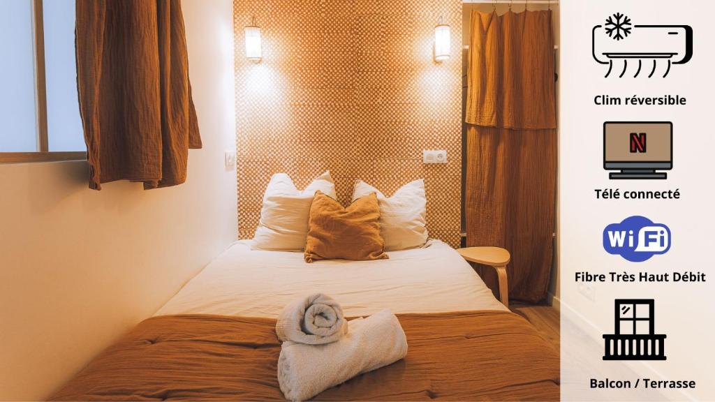 une chambre d'hôtel avec un lit avec des serviettes dessus dans l'établissement Hypercentre-le petit Marseillais - Clim&Balcon, à Marseille